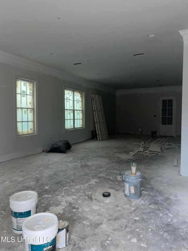 empty room featuring ornamental molding