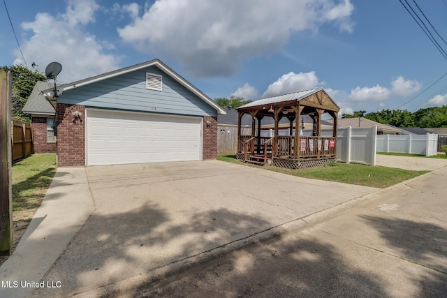 176 Briarfield Ave, Biloxi, MS 39531 - view of front of home with brick siding, a gazebo, a garage, and driveway