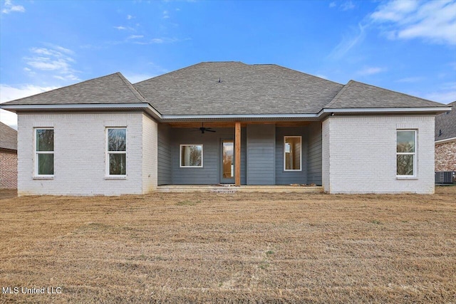 121 Ashby Ridge Dr, Canton, MS 39046 - back of house with a ceiling fan, roof with shingles, brick siding, and a lawn