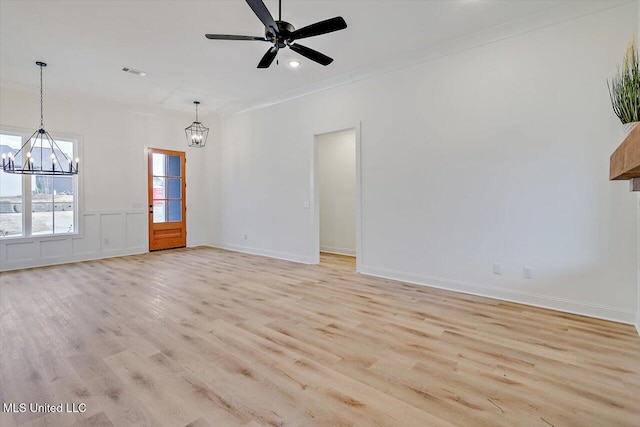121 Ashby Ridge Dr, Canton, MS 39046 - unfurnished living room with a chandelier, light wood-type flooring, ceiling fan, ornamental molding, and baseboards