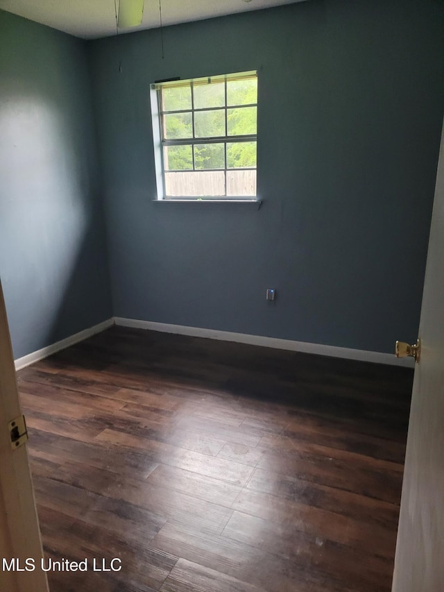 15512 Anderson Dr, Biloxi, MS 39532 - empty room with dark wood-style flooring and baseboards
