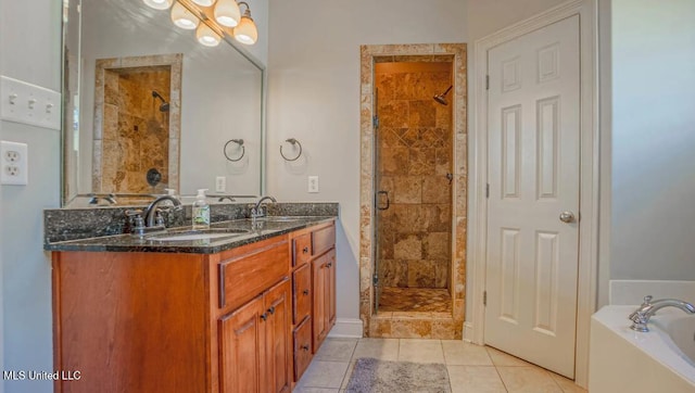 bathroom featuring separate shower and tub, tile patterned flooring, and vanity