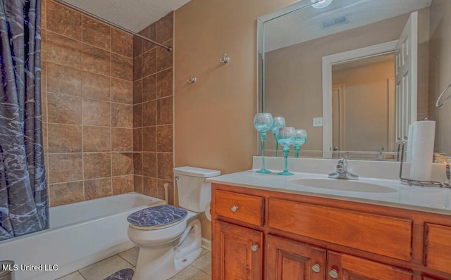 full bathroom with shower / tub combo, tile patterned flooring, toilet, vanity, and a textured ceiling