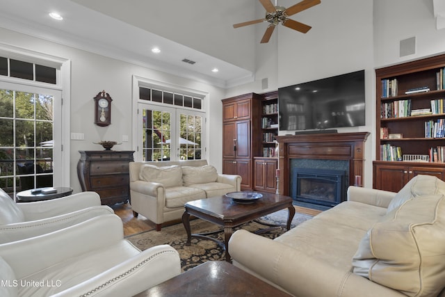 living room with a healthy amount of sunlight, hardwood / wood-style floors, and ceiling fan