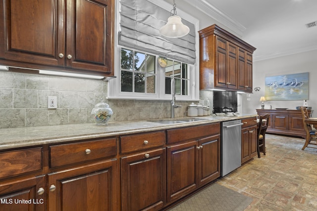 kitchen featuring stainless steel dishwasher, decorative light fixtures, sink, and backsplash