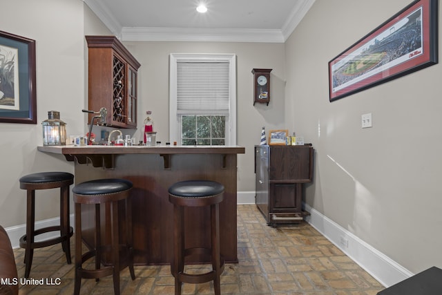 bar featuring crown molding