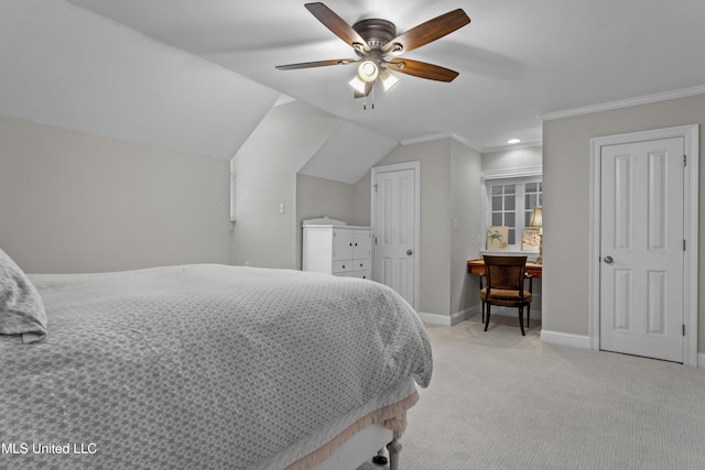 carpeted bedroom with crown molding, ceiling fan, and lofted ceiling