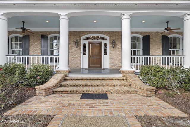 entrance to property featuring ceiling fan and covered porch