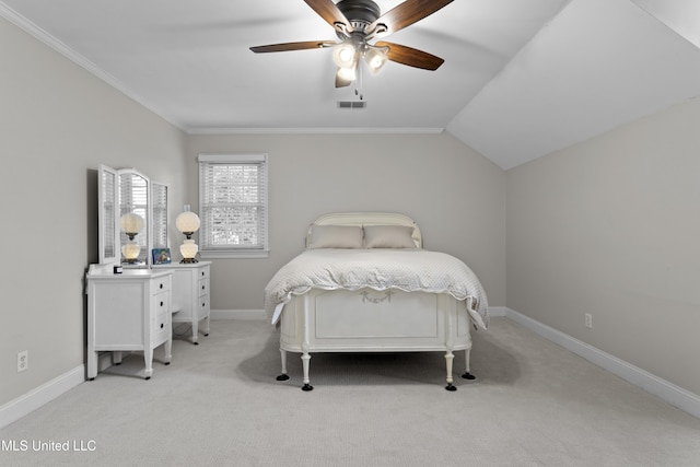 bedroom featuring vaulted ceiling, ceiling fan, crown molding, and light colored carpet