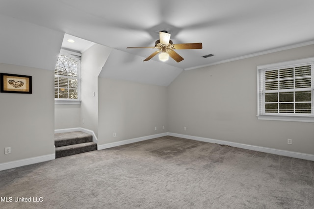 bonus room with ceiling fan, lofted ceiling, and carpet flooring