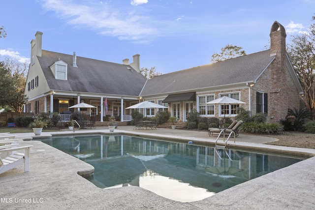 view of swimming pool featuring a patio area