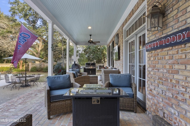 view of patio featuring ceiling fan, outdoor lounge area, and area for grilling