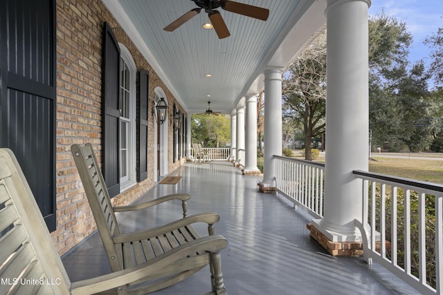 view of patio featuring ceiling fan and a porch