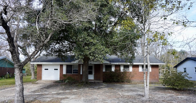 single story home with a garage