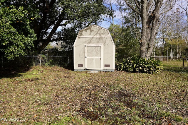 view of outdoor structure featuring a lawn