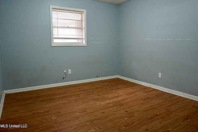 spare room featuring hardwood / wood-style flooring