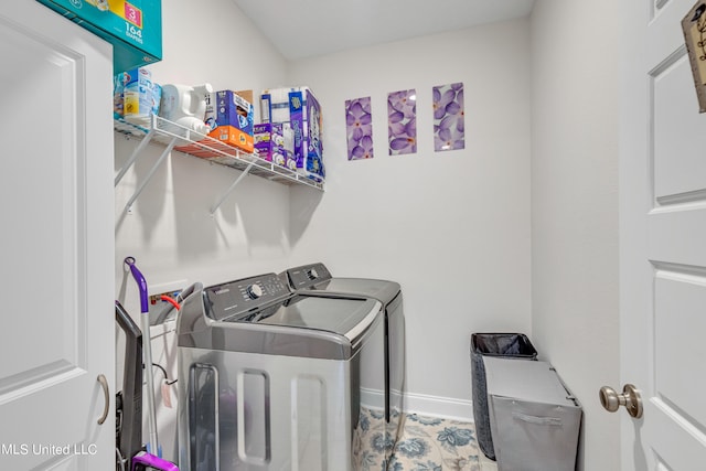 clothes washing area with independent washer and dryer