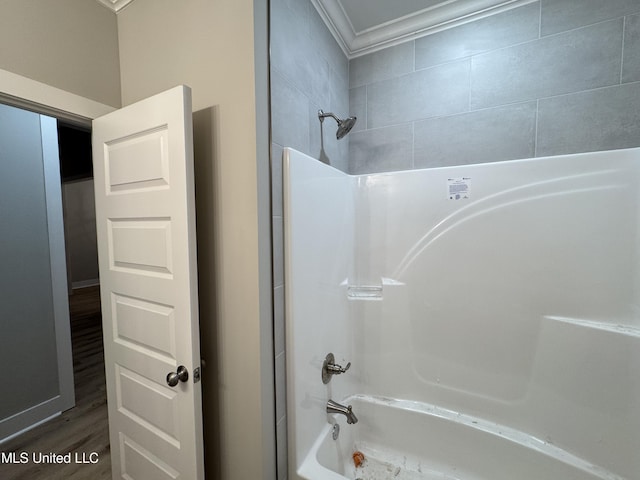 full bath with tub / shower combination and wood finished floors