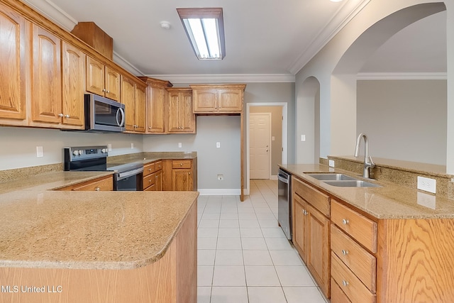 kitchen featuring appliances with stainless steel finishes, sink, ornamental molding, light tile patterned floors, and light stone countertops