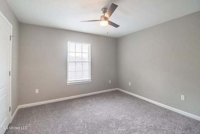 unfurnished room with ceiling fan and carpet floors