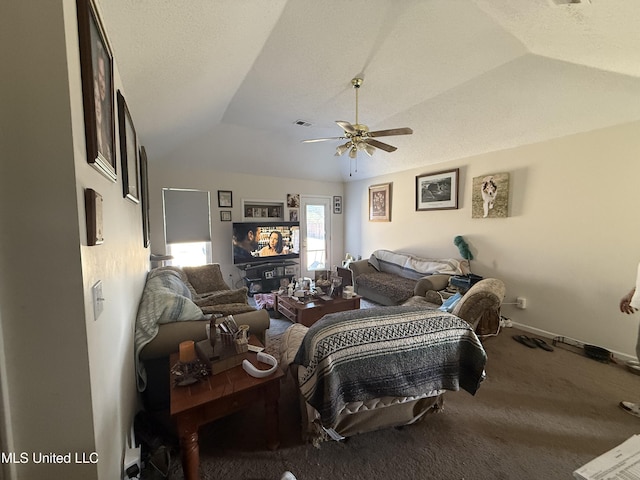 carpeted living room featuring ceiling fan, lofted ceiling, and a textured ceiling