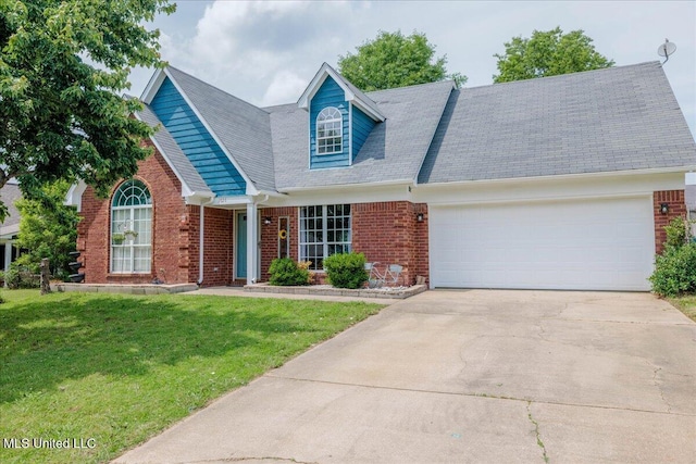 1826 Towson Ln, Horn Lake, MS 38637 - view of front facade with brick siding, a front lawn, concrete driveway, a garage, and roof with shingles