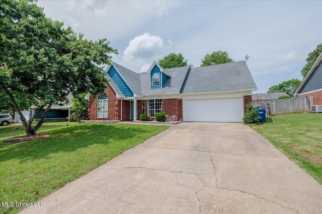 1826 Towson Ln, Horn Lake, MS 38637 - view of front of house with brick siding, a garage, concrete driveway, and central AC unit