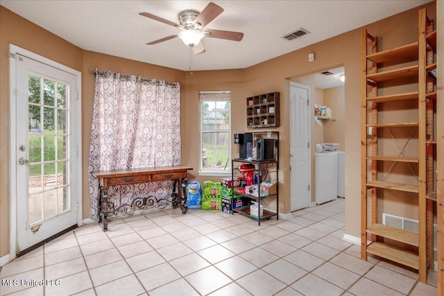1826 Towson Ln, Horn Lake, MS 38637 - tiled dining area featuring washer / clothes dryer, ceiling fan, healthy amount of natural light, and baseboards