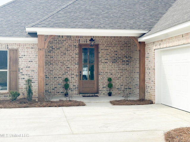 entrance to property featuring a garage