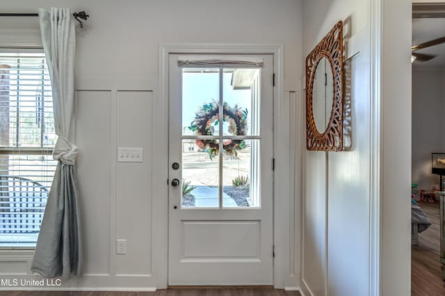 doorway with hardwood / wood-style flooring and plenty of natural light