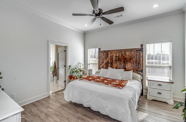 bedroom with wood-type flooring, ornamental molding, ceiling fan, and ensuite bathroom