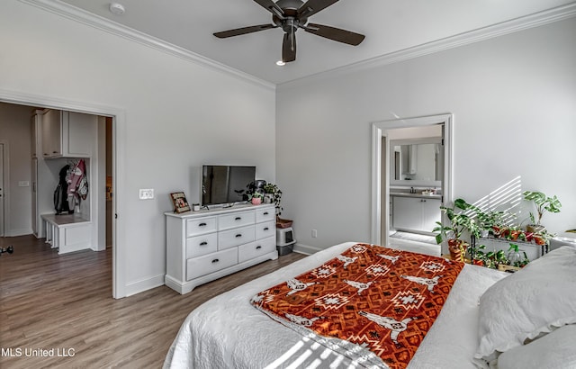 bedroom with ceiling fan, ornamental molding, ensuite bath, and wood-type flooring