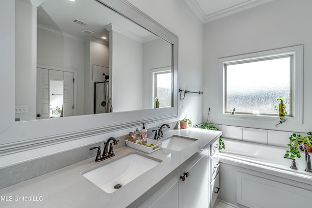 bathroom featuring vanity, ornamental molding, and shower with separate bathtub