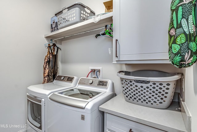 laundry area featuring cabinets and independent washer and dryer