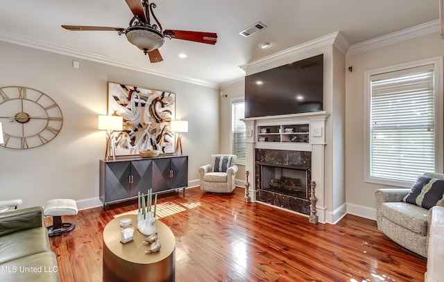 521 Heyward Ln, Madison, MS 39110 - living room with ceiling fan, a fireplace, ornamental molding, wood finished floors, and baseboards