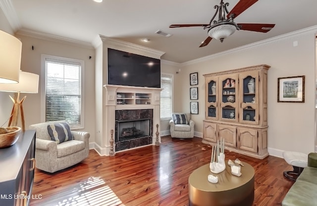 521 Heyward Ln, Madison, MS 39110 - living area with wood finished floors, crown molding, ceiling fan, a fireplace, and baseboards