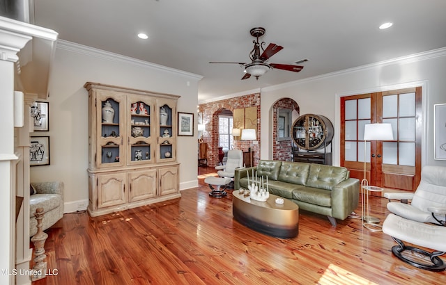 521 Heyward Ln, Madison, MS 39110 - living area with crown molding, ceiling fan, wood finished floors, baseboards, and french doors
