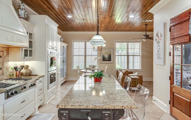 521 Heyward Ln, Madison, MS 39110 - kitchen with appliances with stainless steel finishes, wood ceiling, light tile patterned floors, a center island, and a ceiling fan