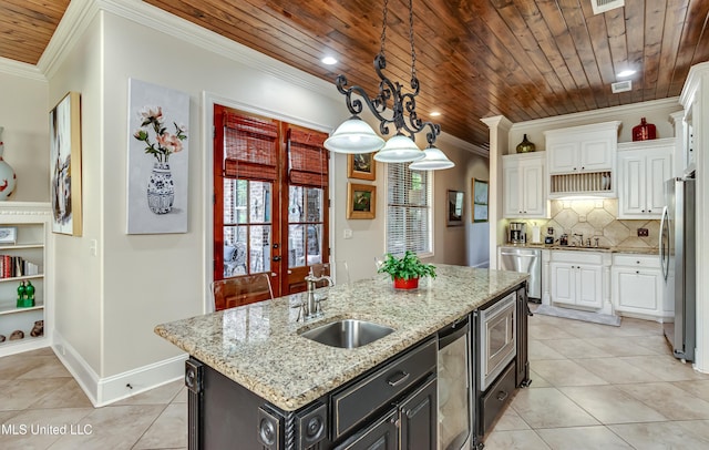 521 Heyward Ln, Madison, MS 39110 - kitchen with stainless steel appliances, a sink, plenty of natural light, white cabinetry, and wooden ceiling