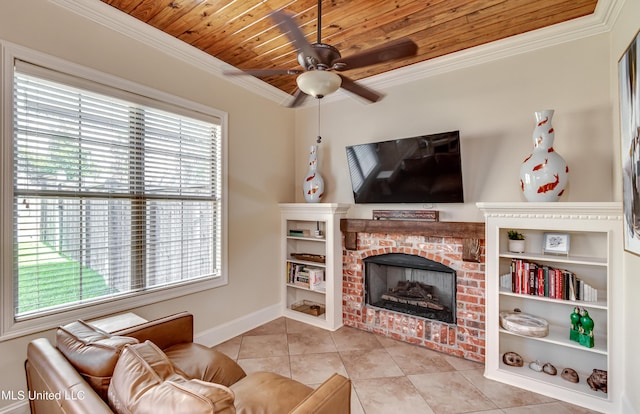 521 Heyward Ln, Madison, MS 39110 - living area with tile patterned floors, ceiling fan, baseboards, crown molding, and a fireplace