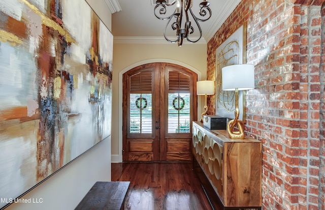 521 Heyward Ln, Madison, MS 39110 - entrance foyer with crown molding, arched walkways, dark wood-style floors, a chandelier, and french doors