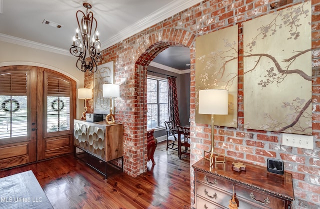 521 Heyward Ln, Madison, MS 39110 - entrance foyer featuring arched walkways, wood finished floors, ornamental molding, and a chandelier