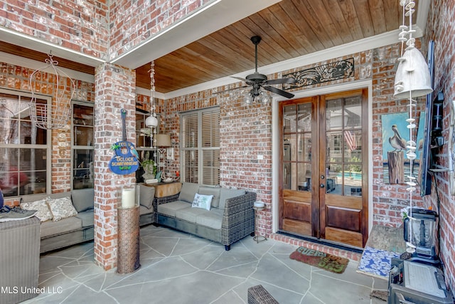 521 Heyward Ln, Madison, MS 39110 - view of exterior entry with french doors, brick siding, ceiling fan, and an outdoor hangout area