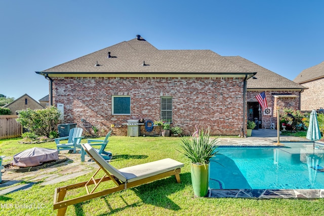 521 Heyward Ln, Madison, MS 39110 - back of house with a shingled roof, an outdoor fire pit, brick siding, a patio area, and central air condition unit