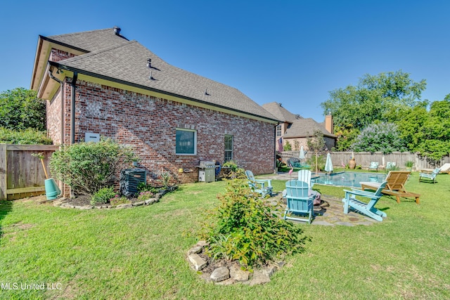 521 Heyward Ln, Madison, MS 39110 - back of house with a shingled roof, brick siding, and central air condition unit