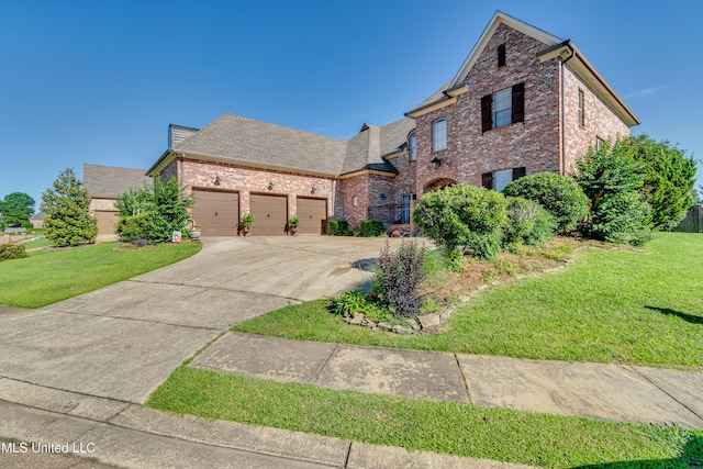 521 Heyward Ln, Madison, MS 39110 - traditional-style home with driveway, an attached garage, a front lawn, and brick siding