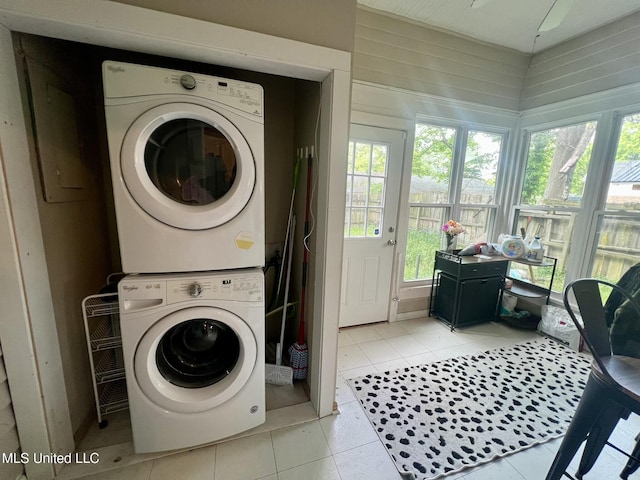 701 Court St, Cleveland, MS 38732 - clothes washing area featuring laundry area, light tile patterned floors, and stacked washer / dryer