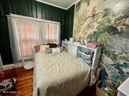 701 Court St, Cleveland, MS 38732 - bedroom with crown molding and wood finished floors