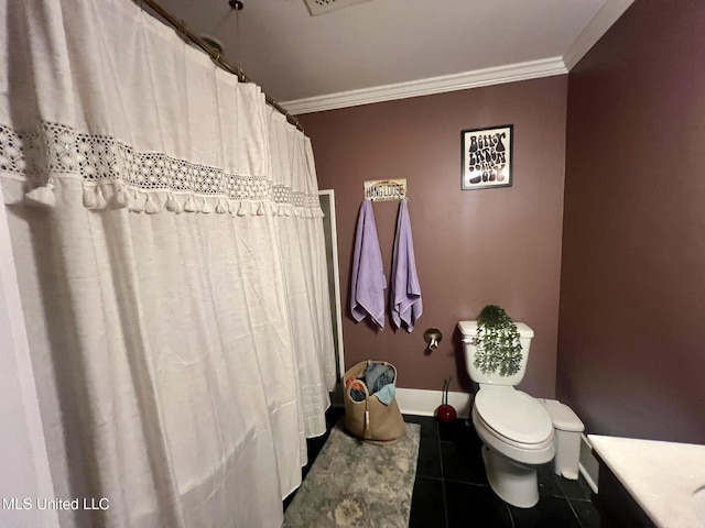701 Court St, Cleveland, MS 38732 - full bath featuring crown molding, tile patterned floors, baseboards, and toilet