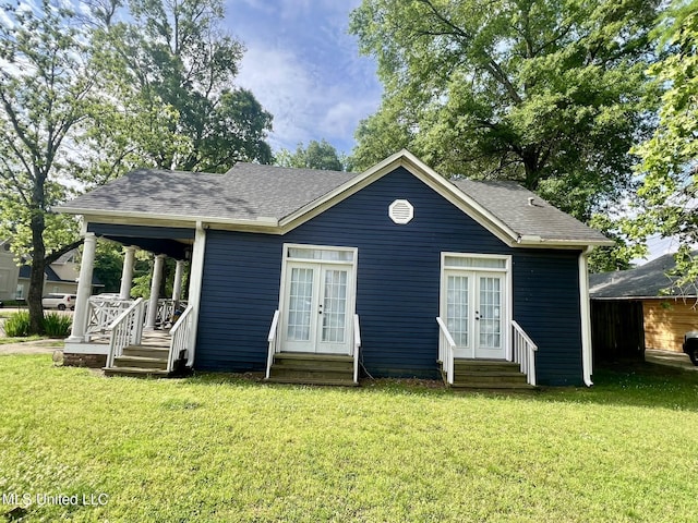 701 Court St, Cleveland, MS 38732 - rear view of house with a shingled roof, a yard, french doors, and entry steps